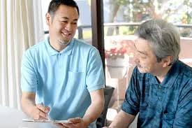 IHSS caregiver helping patient with a medical condition